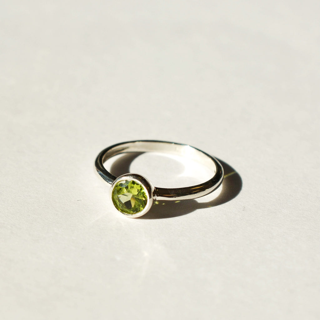 Large Bezel Set Faceted Peridot Ring